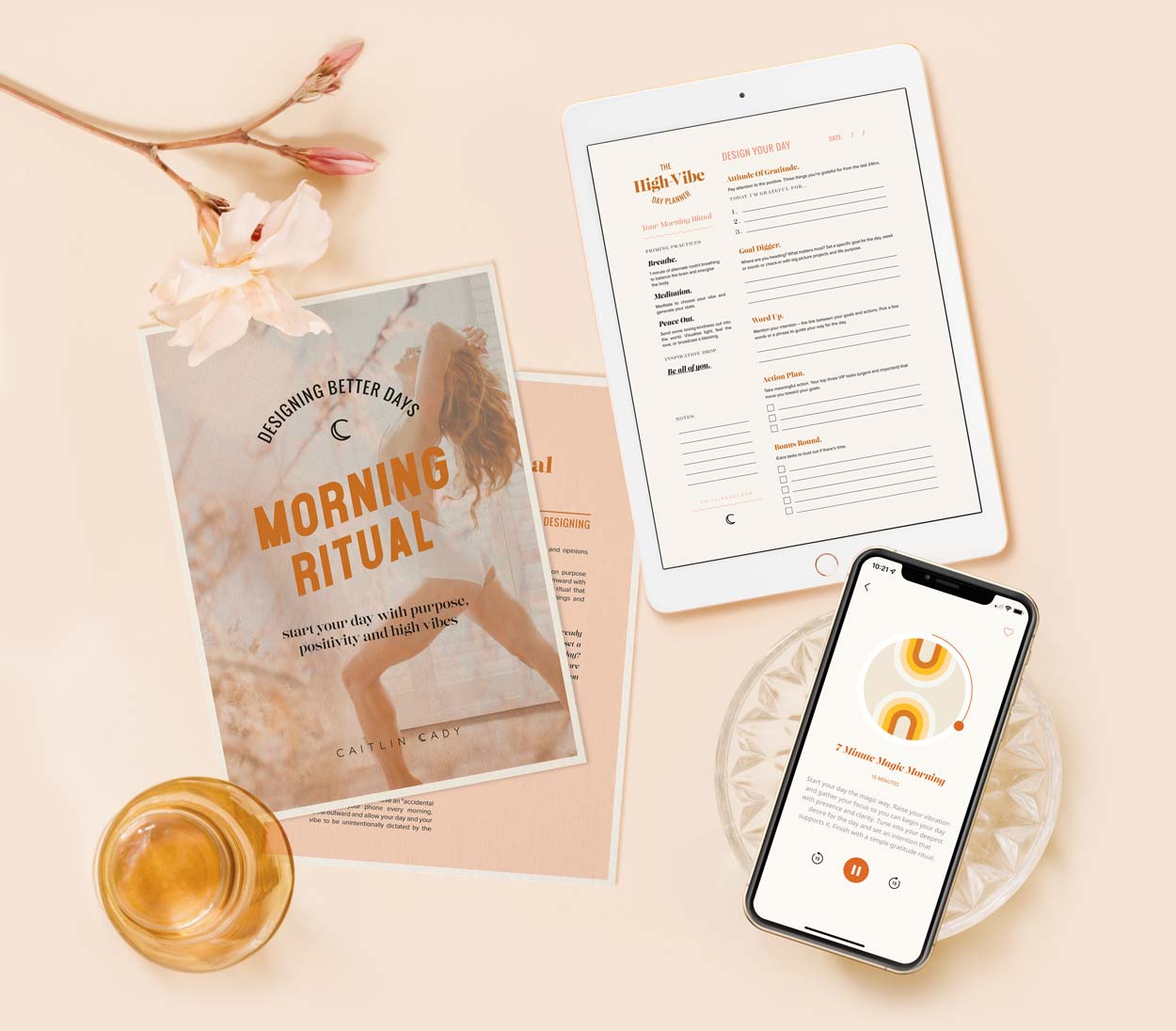 A visual display of the contents of the Morning Ritual bundle: The Morning Ritual Guidebook, the High-Vibe Day Planner, and a morning meditation